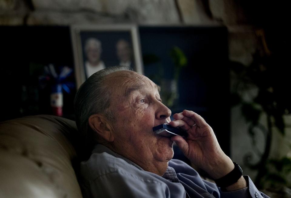 Ren Willie plays harmonica at his Murray home on Wednesday, July 5, 2023. A year ago, Willie was diagnosed with Alzheimer’s dementia, a progressive neurodegenerative disease that destroys memory and other mental functions over time. | Laura Seitz, Deseret News