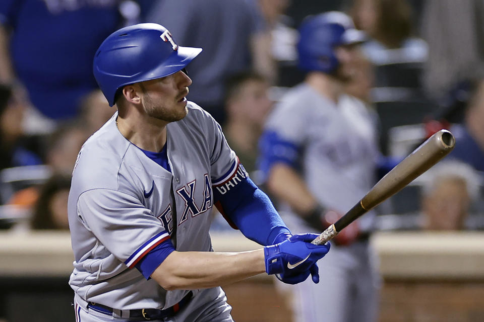 Texas Rangers' Mitch Garver watches his home run against the New York Mets during the seventh inning of a baseball game Tuesday, Aug. 29, 2023, in New York. (AP Photo/Adam Hunger)