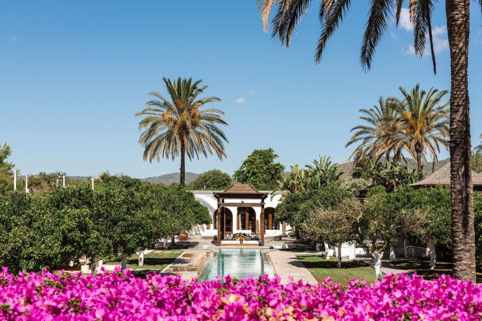 <p>This bougainvillea-draped agriturismo is another place to enjoy the quieter side of Ibiza, with super-clubs swapped out for 30 acres of manicured gardens, courtyards, vegetable patches, pools and pavilions. <a href="https://www.booking.com/hotel/es/atzaro.en-gb.html?aid=2200765&label=luxury-ibiza-hotels" rel="nofollow noopener" target="_blank" data-ylk="slk:Atzaró;elm:context_link;itc:0;sec:content-canvas" class="link ">Atzaró</a> is basically a village to meander through, all the while accompanied by the scent of citrus courtesy of the farm’s orange groves.<br><br>The rooms are as rustic as you’d hope, with terracotta floors, original beams, draped four-poster beds and stone walls. Unsurprisingly, farm-to-table food is an actual thing at the restaurant – and you can enjoy it on a terrace or beneath a vine-wrapped pergola.</p><p><a class="link " href="https://www.booking.com/hotel/es/atzaro.en-gb.html?aid=2200765&label=luxury-ibiza-hotels" rel="nofollow noopener" target="_blank" data-ylk="slk:CHECK AVAILABILITY;elm:context_link;itc:0;sec:content-canvas">CHECK AVAILABILITY</a></p>