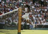 Dustin Brown of Germany hits a shot during his match against Rafael Nadal of Spain at the Wimbledon Tennis Championships in London, July 2, 2015. REUTERS/Stefan Wermuth