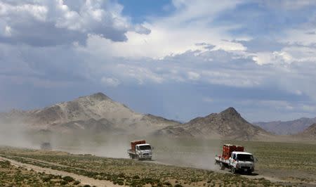 Trucks carrying Przewalski's horses drive to Takhin Tal National Park, part of the Gobi B Strictly Protected Area, in south-west Mongolia, June 20, 2017. REUTERS/David W Cerny