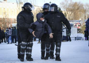 Police detain a man during a protest against the jailing of opposition leader Alexei Navalny in Siberian city of Omsk, Russia, on Sunday, Jan. 31, 2021. Thousands of people took to the streets Sunday across Russia to demand the release of jailed opposition leader Alexei Navalny, keeping up the wave of nationwide protests that have rattled the Kremlin. Hundreds were detained by police. (AP Photo)