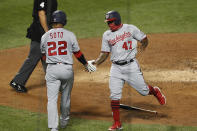 Washington Nationals' Juan Soto (22) celebrates with designated hitter Howie Kendrick (47) after the pair scored on Asdrubal Cabrera's fifth-inning double in a baseball game against the New York Mets, Monday, Aug. 10, 2020, in New York. (AP Photo/Kathy Willens)