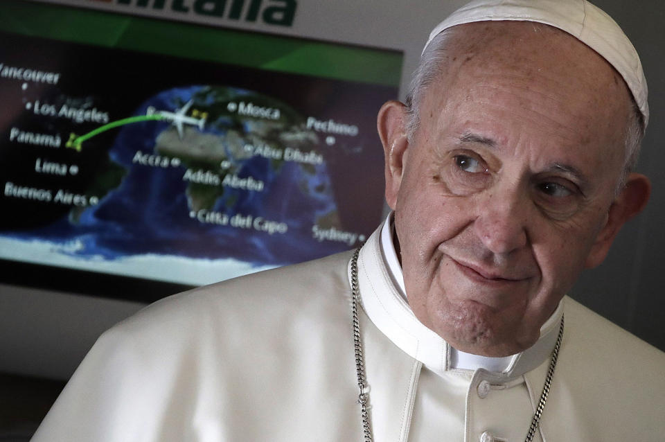 FILE - In this Jan. 23, 2019, file photo, Pope Francis arrives to talk to journalists during his flight from Rome to Panama City where he will attend the World Youth Day. Across the globe, Pope Francis’ comments endorsing same-sex civil unions were received by some as encouragement for an advancing struggle and condemned by others as an earth-shaking departure from church doctrine. (AP Photo/Alessandra Tarantino, File)