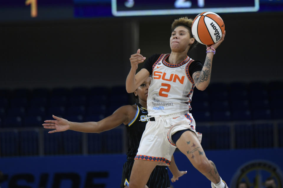 Connecticut Sun's Natisha Hiedeman (2) goes up for a last-second shot against Chicago Sky's Lexie Brown (7) during the first period of Game 3 of a WNBA semifinal playoff basketball game Sunday, Oct. 3, 2021, in Chicago. (AP Photo/Paul Beaty)