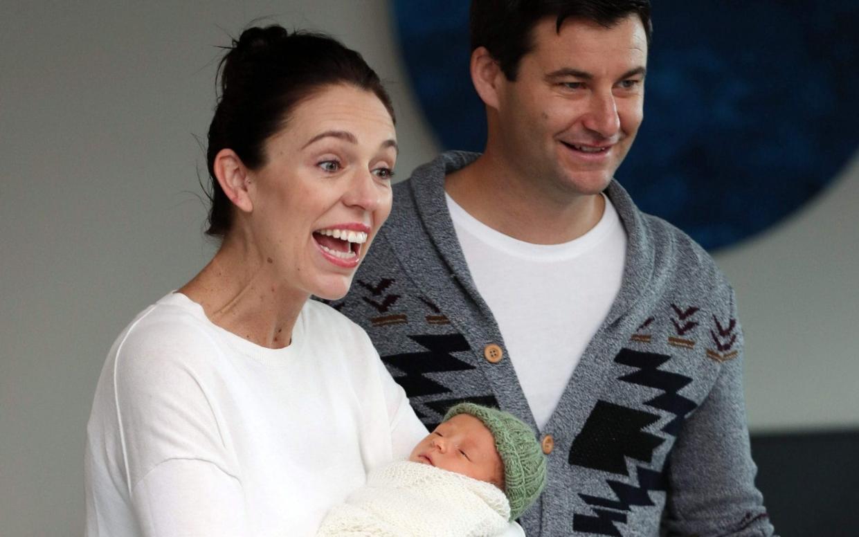 New Zealand prime minister Jacinda Ardern and partner Clarke Gayford pose with their baby daugther Neve Te Aroha - AFP