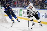 Los Angeles Kings' Carl Grundstrom (91) controls the puck as St. Louis Blues' Robert Bortuzzo (41) defends during the third period of an NHL hockey game Monday, Oct. 25, 2021, in St. Louis. (AP Photo/Jeff Roberson)