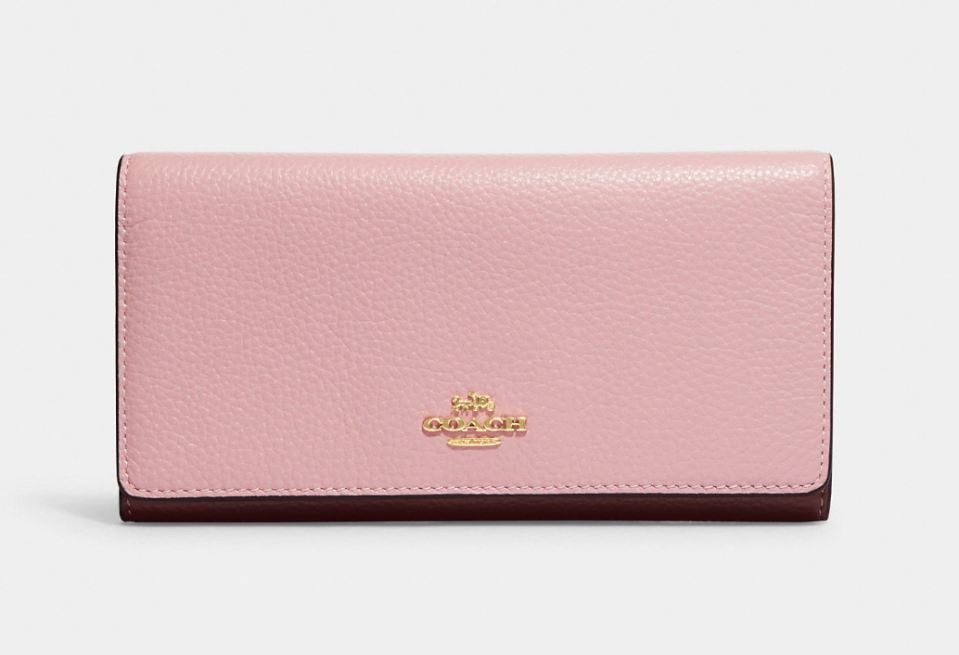 Slim Trifold Wallet. Image via Coach Outlet.