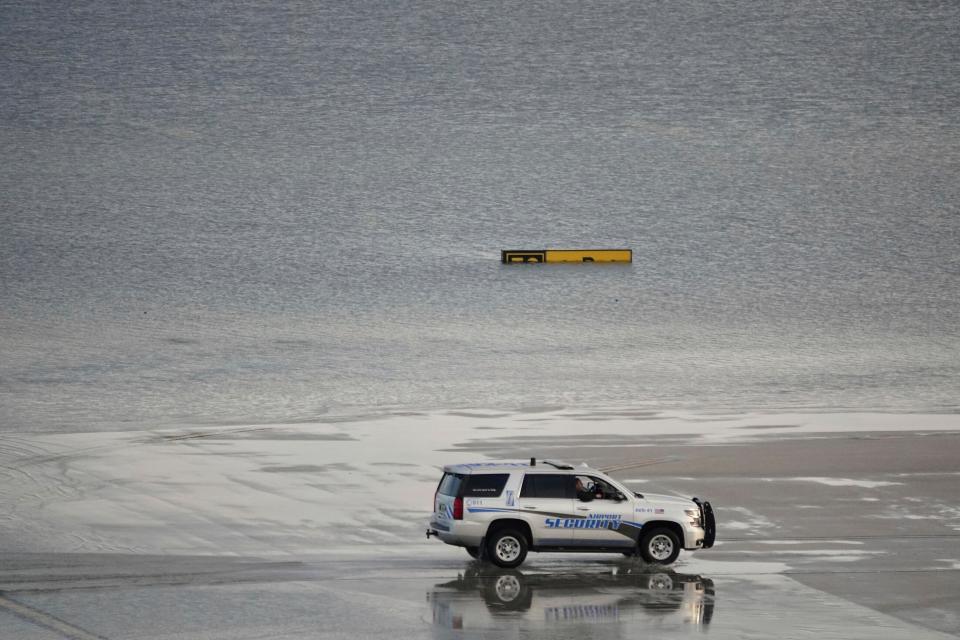 Flooding lingers at Fort Lauderdale-Hollywood International Airport on Thursday, April 13, 2023 after heavy rain pounded South Florida on Wednesday.