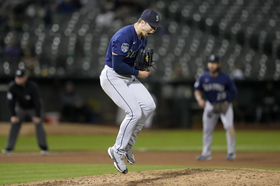 Seattle Mariners pitcher Bryan Woo celebrates after striking out Oakland Athletics' Nick Allen during the fourth inning of a baseball game in Oakland, Calif., Monday, Sept. 18, 2023. (AP Photo/Jeff Chiu)