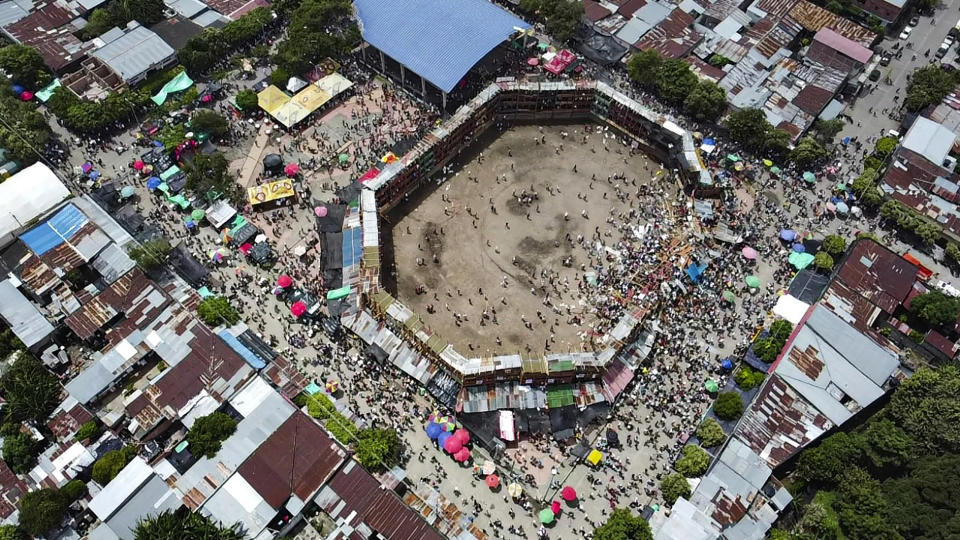 Aerial view of the collapsed grandstand in a bullring in the Colombian municipality of El Espinal, southwest of Bogotá, on June 26, 2022. - At least four people were killed and another 30 seriously injured when a full three-story section of wooden stands filled with spectators collapsed, throwing dozens of people to the ground, during a popular event at which members of the public face off with small bulls, officials said. (Photo by SAMUEL ANTONIO GALINDO CAMPOS / AFP) (Photo by SAMUEL ANTONIO GALINDO CAMPOS/AFP via Getty Images)