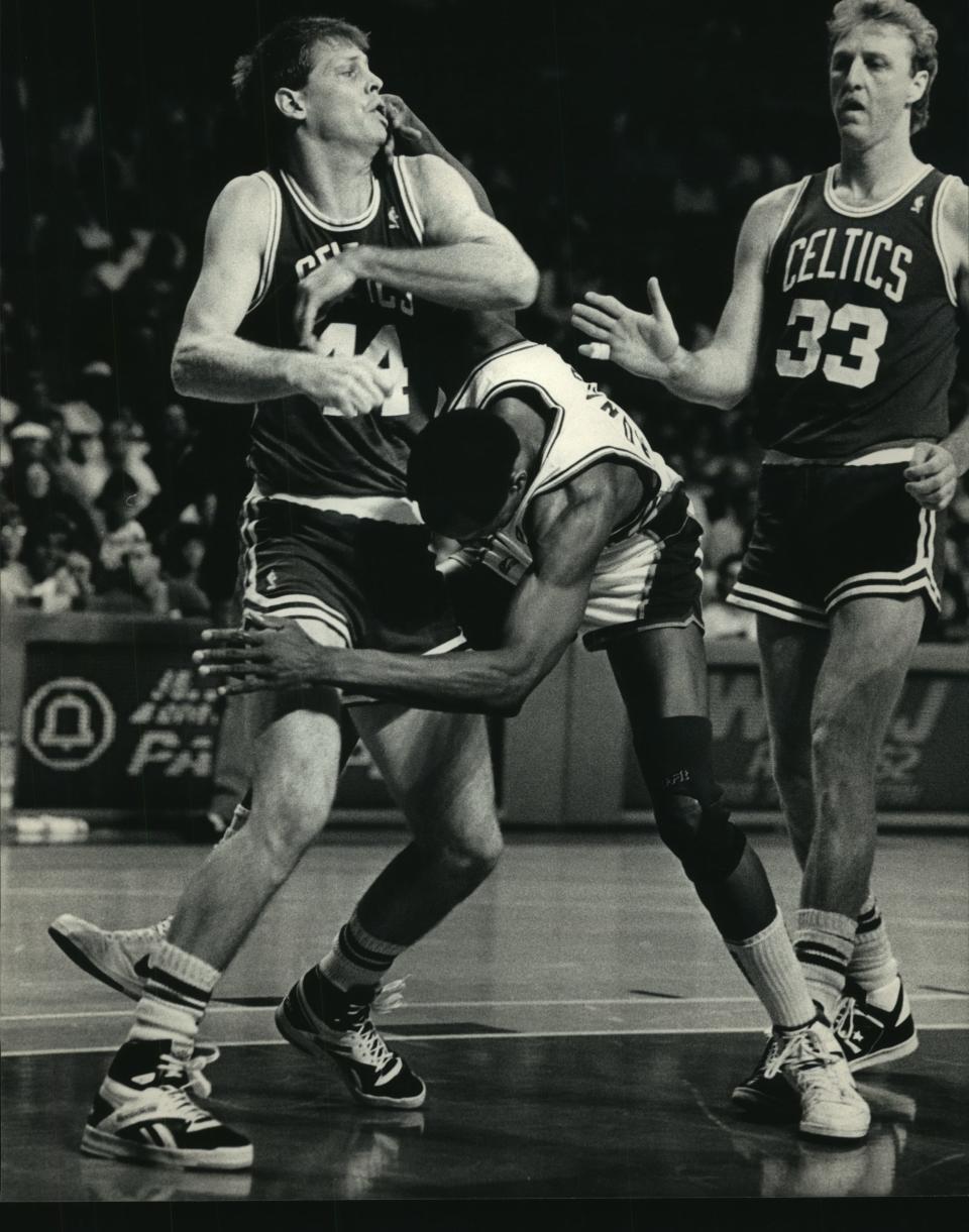 1987: Boston's Danny Ainge (left) and Milwaukee's Sidney Moncrief tangle as Larry Bird looks on during second-quarter action in Game 6 of the Eastern Conference semifinals at the Milwaukee Arena on May 15, 1987. The Bucks won the game, 121-111, but the Celtics came back and won Game 7 and the series the following day. This photo was published in the May 16, 1987, Milwaukee Journal.