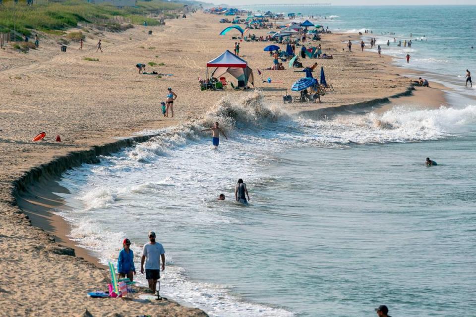 The beach erodes as the tides rises in an area north of Jennette’s Pier on Tuesday, July 20, 2021 in Nags Head, N.C.