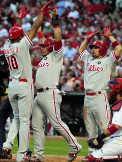 Ben Francisco was greeted by teammates Shane Victorino (far right) and Carlos Ruiz after hitting a pinch-hit home run in the seventh inning