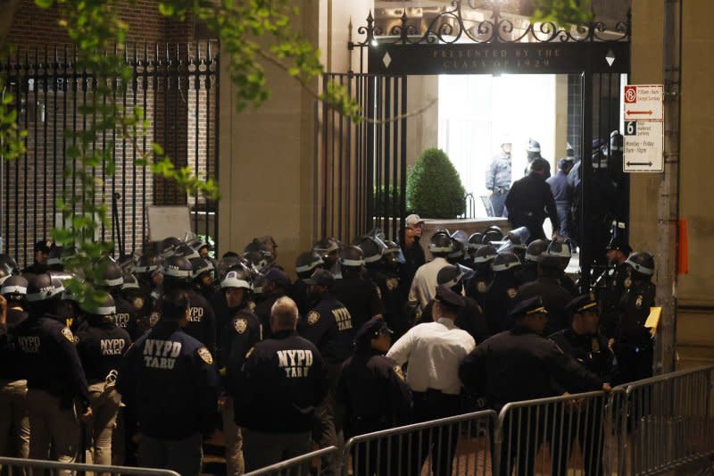 Hundreds of NYPD police officers in riot gear enter Columbia University on Tuesday night before arresting dozens of Pro-Palestine protesters barricaded inside Hamilton Hall. Columbia University said it will maintain a police presence through May 17. Photo by John Angelillo/UPI