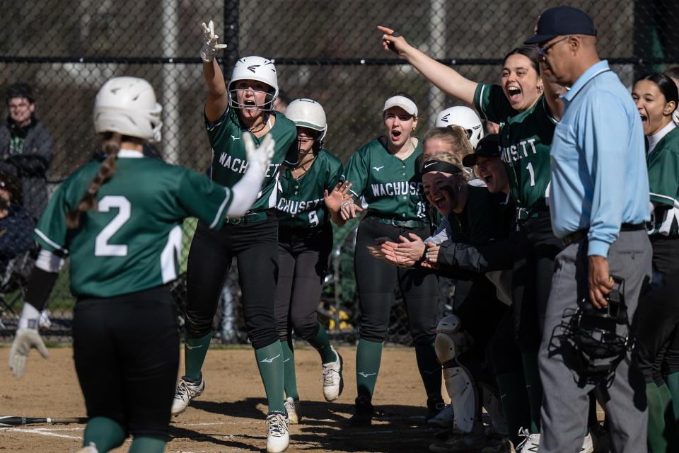 The bench clears to congratulate Wachusett's Caitlin Ciccone on a two-run homer in the top of the third inning.