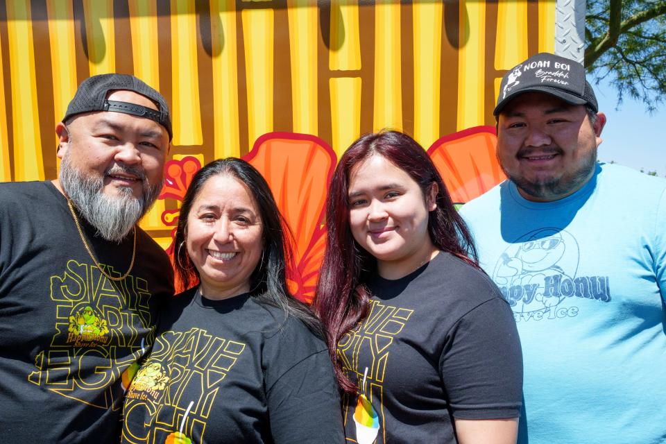 (L-R) Desmond, Laura, Alyssa, and Anthony Martin stand outside the family owned and operated Happy Honu Shave Ice food truck at the Arrowhead Farmers Market on April 16, 2022, in Glendale, Ariz.