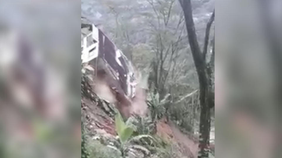 The house came to rest in a raging river after it was swept away in a mudslide. Source: CEN/Australscope