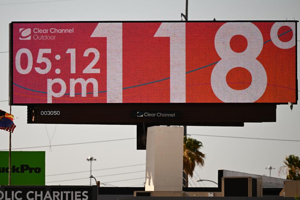 A billboard displays a temperature of 118 degrees Fahrenheit (48 degrees Celsius) during a record heat wave in Phoenix, Arizona on July 18, 2023.