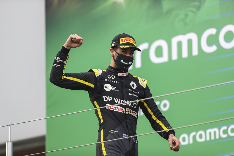 Renault driver Daniel Ricciardo of Australia celebrates on the podium after he placed third in the Eifel Formula One Grand Prix at the Nuerburgring racetrack in Nuerburg, Germany, Sunday, Oct. 11, 2020. (AP Photo/Matthias Schrader, Pool)