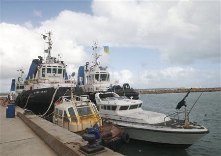 A coastguard boat seized during the 2011 Libyan revolution which was used in the seizing of Mellitah port is moored at the port, 100 km (60 miles) west of Tripoli November 7, 2013. REUTERS/Ismail Zitouny