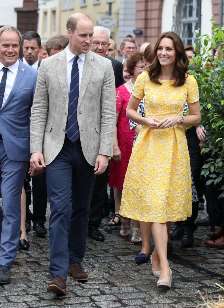 <p><em>July 20, 2017</em> — For a tour of the German city of Heidelberg, Kate returned to two of her go-to fashion choices by wearing a yellow lace dress by Jenny Packham with a pair of <a href="https://www.dsw.com/en/us/product/dolce-vita-shayla-espadrille-wedge-sandal/" rel="nofollow noopener" target="_blank" data-ylk="slk:beige espadrille wedges;elm:context_link;itc:0;sec:content-canvas" class="link ">beige espadrille wedges </a>from Monsoon. </p>