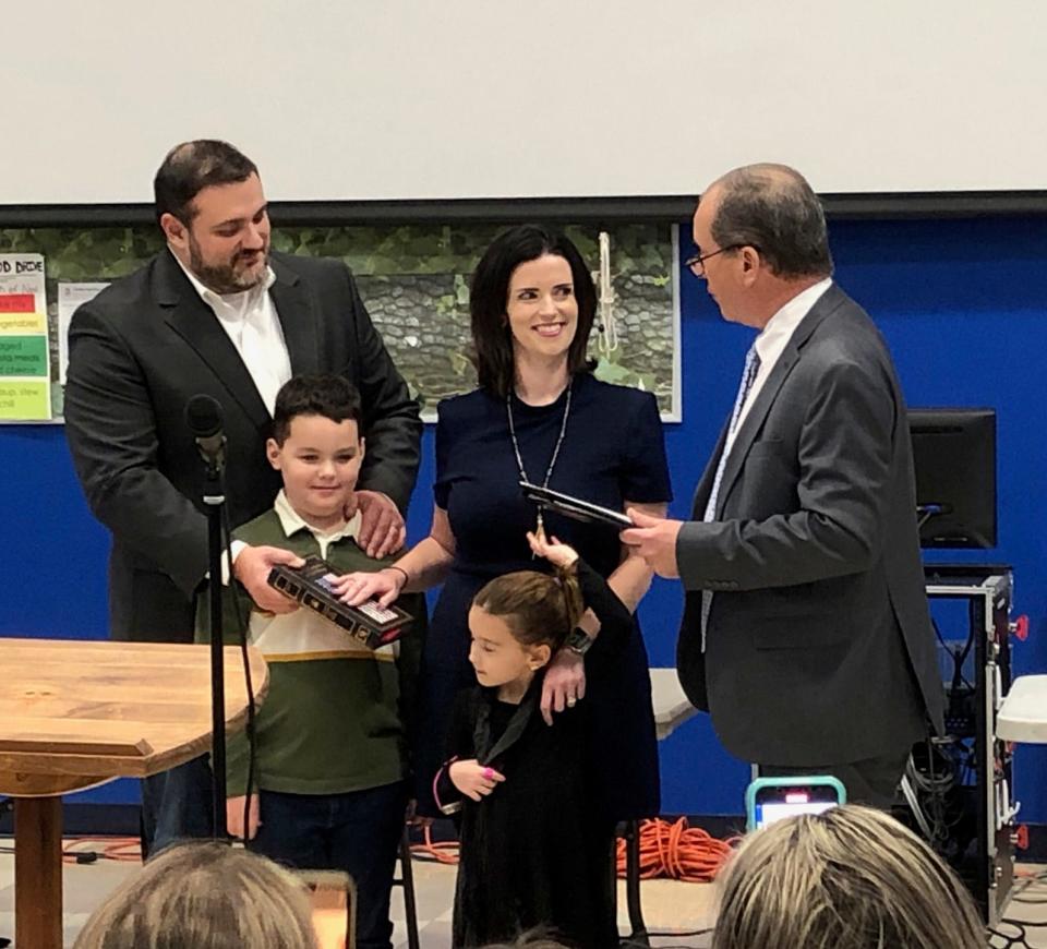 Lauren Spirig, center, takes the oath of office for the Mendham Township Committee accompanied by her husband, John; son Luke, 7; and daughter Zoey, 5, during the committee's reorganization at Mendham Township Middle School Thursday, Jan. 5, 2023. Administering the oath is Mendham attorney Tom Murphy.
