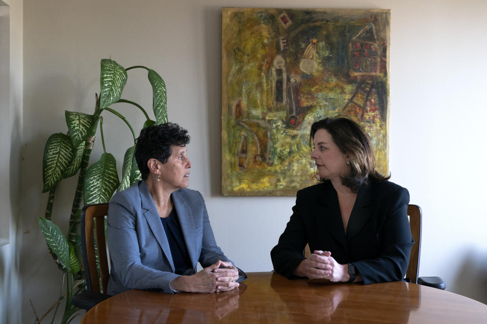 In this May 21, 2021, photo Washington based civil rights attorneys Debra Katz, left, and Lisa Banks, chat before a portrait session at their law firm in Washington. For many people, the pandemic year has brought a pause of some kind, or at least a slowdown, to their professional endeavors. For Katz and Banks, the opposite has been true. “This is probably the biggest year we’ve ever had,” says Banks. Their work has been increasing for nearly four years. When the Harvey Weinstein revelations erupted in October 2017, launching the reckoning that became known as the #MeToo movement, it caused “a sea change," Katz says. (AP Photo/Jacquelyn Martin)