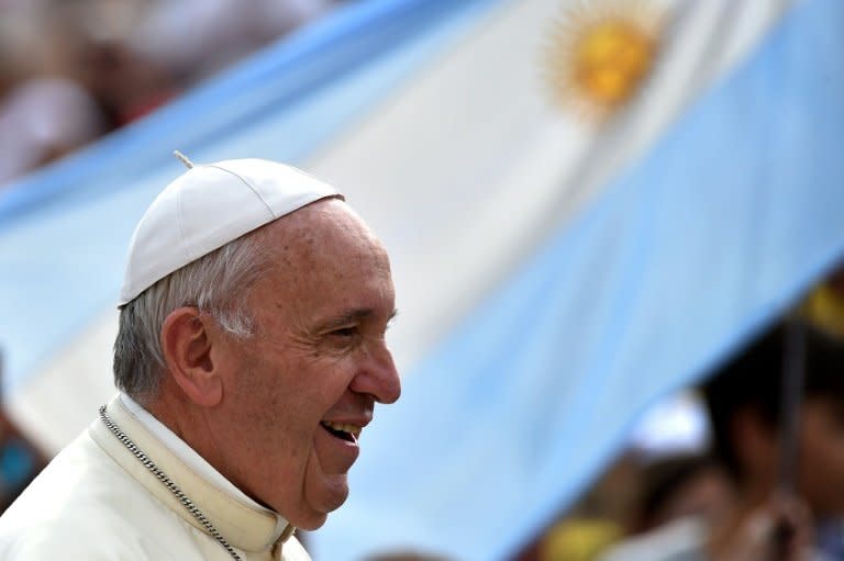 Pope Francis arrives for his weekly general audience in St Peter's Square at the Vatican on August 31, 2016