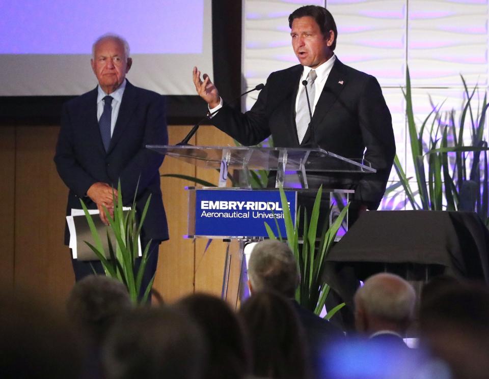 Florida governor Ron DeSantis speaks to the crowd, with ERAU Chairman Mori Hossenini in the background, during the announcement of the Boeing partnership with ERAU and UCF on hypersonic research, Tuesday June 11, 2024 in the ERAU student union.