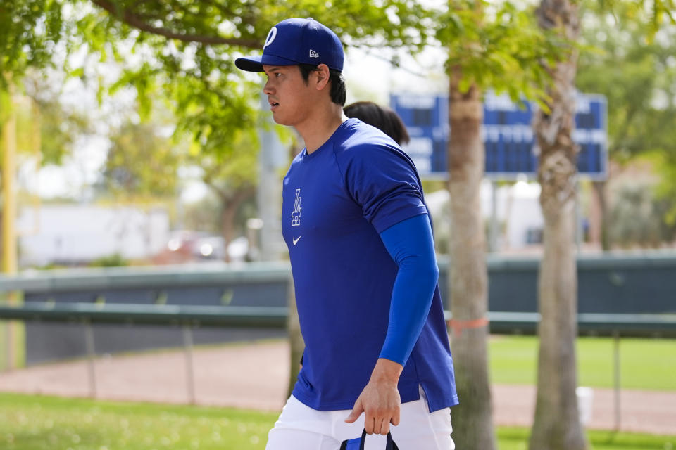 Los Angeles Dodgers designated hitter Shohei Ohtani participates in spring training baseball workouts at Camelback Ranch in Los Angeles, Sunday, Feb. 25, 2024. (AP Photo/Ashley Landis)