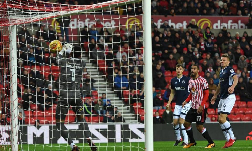 Millwall goalkeeper Jordan Archer spills a cross