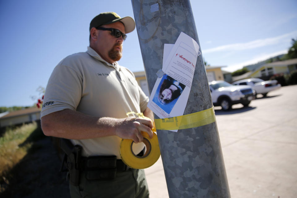 Lake County Sheriff's Deputy G. Wells tapes off an area around a house on Highlands Harbor Drive during the search for missing 9-year-old autistic girl Mikaela Renee Lynch on Monday, May 13, 2013 in Clearlake, Calif. A dive team found Mikaela's body in a muddy creek. The phenomenon of bolting affects large numbers of children with autism, researchers say. And the deaths - 60 in the past four years - are prompting new efforts to raise awareness and find more effective preventive measures. (AP Photo/The Press Democrat, Beth Schlanker)