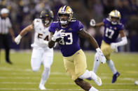 Washington's Devin Culp (83) runs with the ball after a pass reception against California in the first half of an NCAA college football game Saturday, Sept. 25, 2021, in Seattle. (AP Photo/Elaine Thompson)