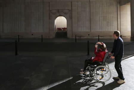 Visitors look at engraved names of Commonwealth soldiers who died in World War One at the Menin Gate Memorial in Ypres October 20, 2014. REUTERS/Francois Lenoir