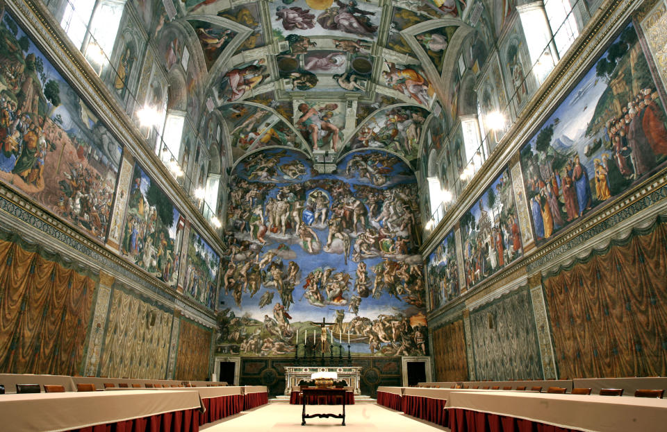 FILE - In this April 16, 2005 file photo, tables and chairs line the Sistine Chapel at the Vatican in preparation for the conclave. Five centuries after Michelangelo's ceiling frescoes were inaugurated at the Sistine Chapel, at least 10,000 people visit the site each day, raising concerns about temperature, dust and humidity affecting the famed art. But a Vatican Museums official said in the Vatican newspaper Wednesday, Oct. 31, 2012 that there are no plans to try to limit tourists' access. (AP Photo/Pier Paolo Cito, File)