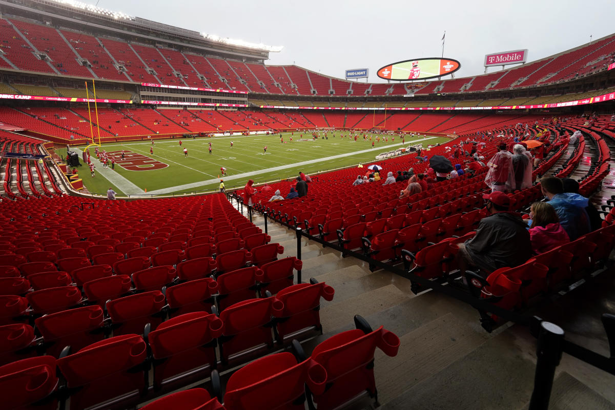 A Kansas City Chiefs fan wearing a head dress tries to get the attention of  a player before the Chiefs-Arizona Cardinals game at the University of  Phoenix Stadium in Glendale, December 7