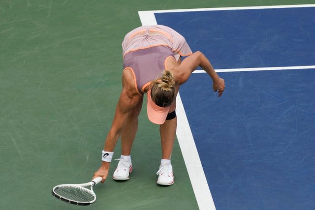 Victoria Golubic hits her racket on the floor