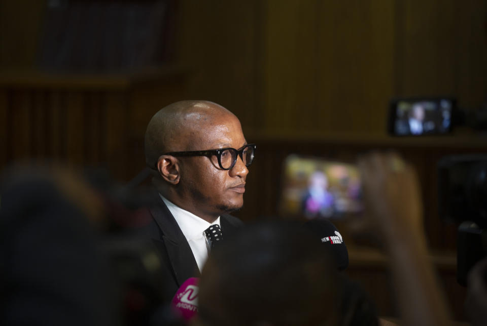 National Prosecuting Authorities' representative Adv.Mthunzi Mhaga addresses the press in the High Court, in Pretoria, South Africa, Tuesday, April 2, 2024. South Africa's speaker of parliament Nosiviwe Mapisa-Nqakula faces imminent arrest over corruption charges after her bid to block police and prosecutors from arresting her was dismissed by the North Gauteng High Court in Pretoria Tuesday. (AP Photo/Denis Farrell)