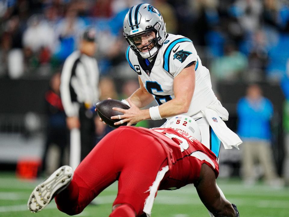 Baker Mayfield is tackled during a game against the Arizona Cardinals.