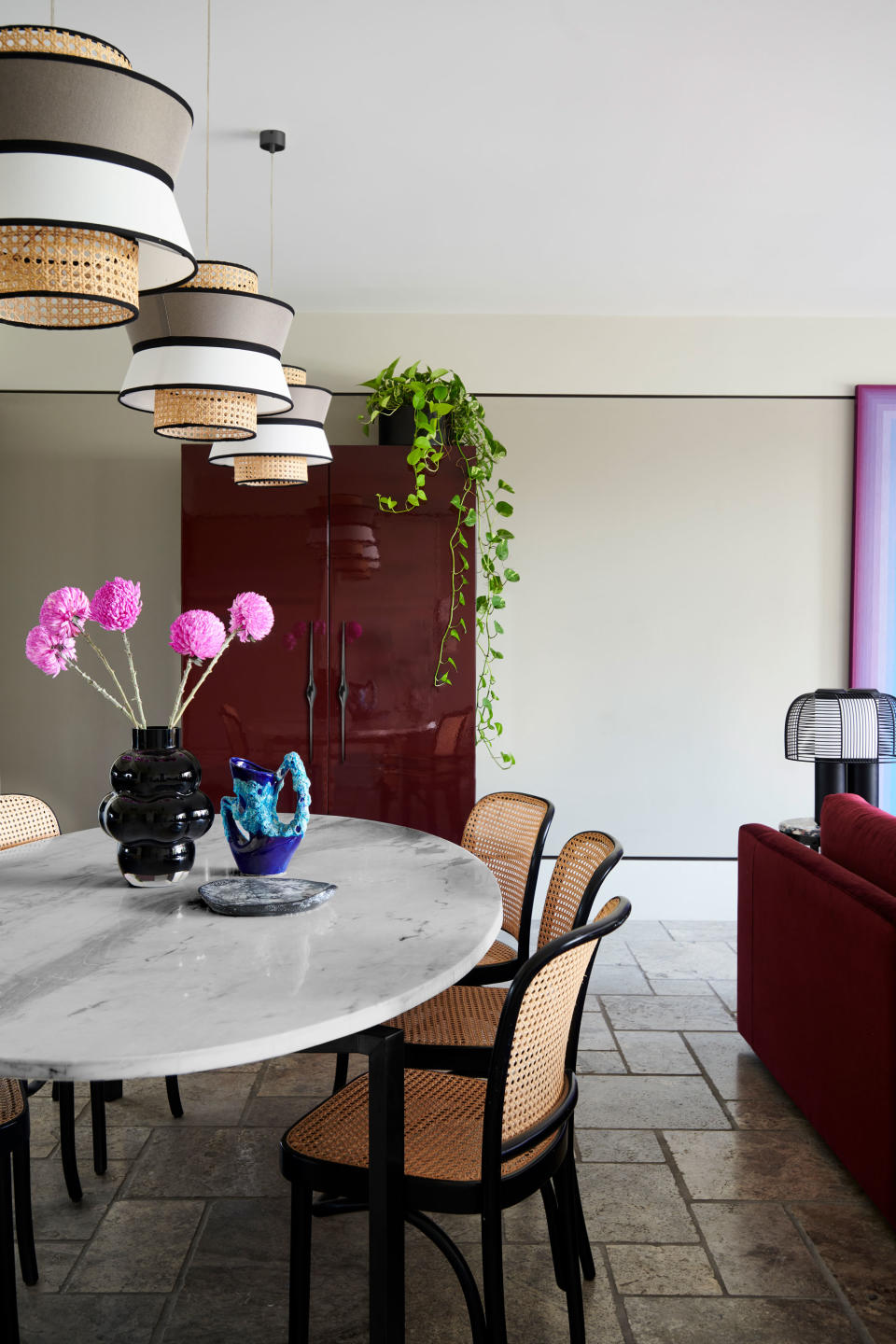 a dining room with overflow kitchen storage