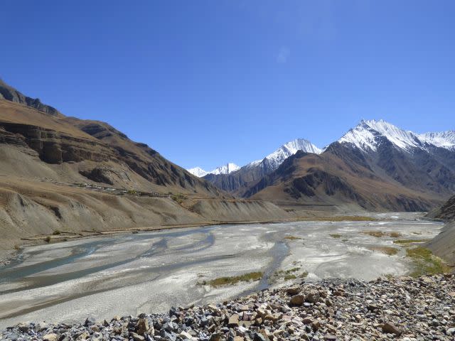 The River Pin separates horse pastures from the village. <span class="inline-image-credit">(Janaki Lenin)</span>