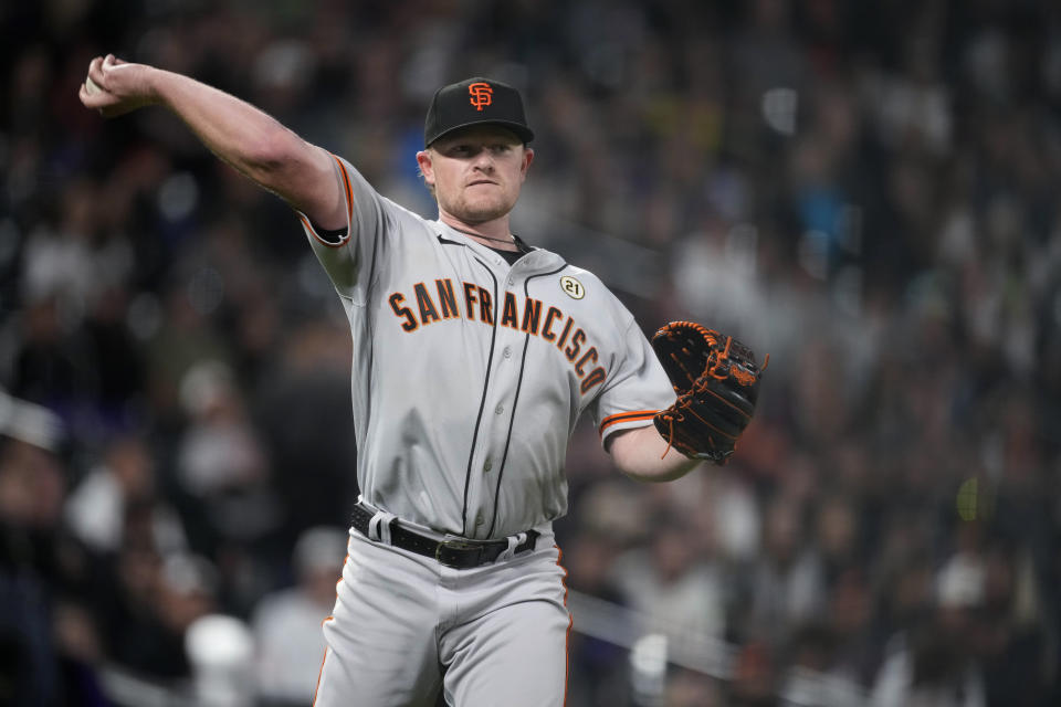 San Francisco Giants starting pitcher Logan Webb throws to first base to put out Colorado Rockies' Elehuris Montero to end the seventh inning of a baseball game Friday, Sept. 15, 2023, in Denver. (AP Photo/David Zalubowski)