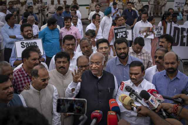 Congress party President Mallikarjun Kharge, centre, speaks during a protest against the Narendra Modi-led government alleging that Indian democracy is in danger, during a protest outside India's parliament in New Delhi, India, Friday, March 24, 2023. Key Indian opposition Congress party leader Rahul Gandhi lost his parliamentary seat as he was disqualified following his conviction by a court that found him of guilty of defamation over his remarks about Prime Minister Narendra Modi's surname, a parliamentary notification said on Friday. (AP Photo/Altaf Qadri)