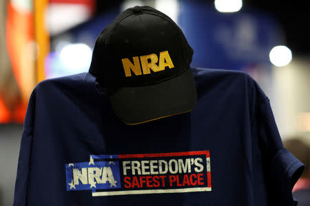 A cap and shirt are displayed at the booth for the National Rifle Association (NRA) at the Conservative Political Action Conference (CPAC) at National Harbor, Maryland, U.S., February 23, 2018. REUTERS/Joshua Roberts