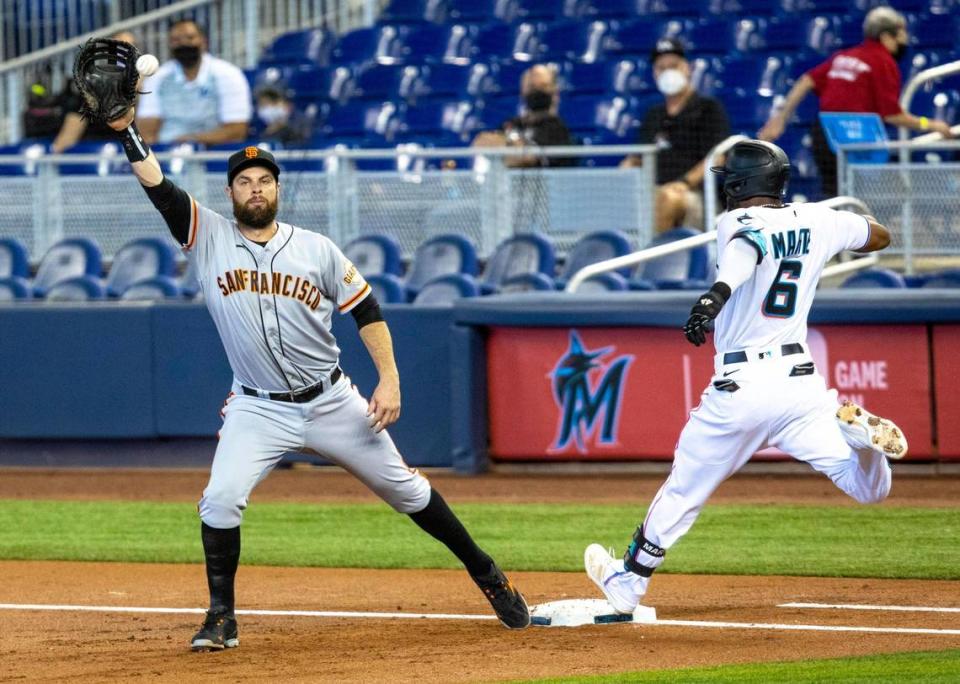 Miami Marlins outfielder Starling MarteÂ (6) is called safe at first base during the first inning of an MLB game against the San Francisco Giants at loanDepot park in the Little Havana neighborhood of Miami, Florida, on Sunday, April 18, 2021.