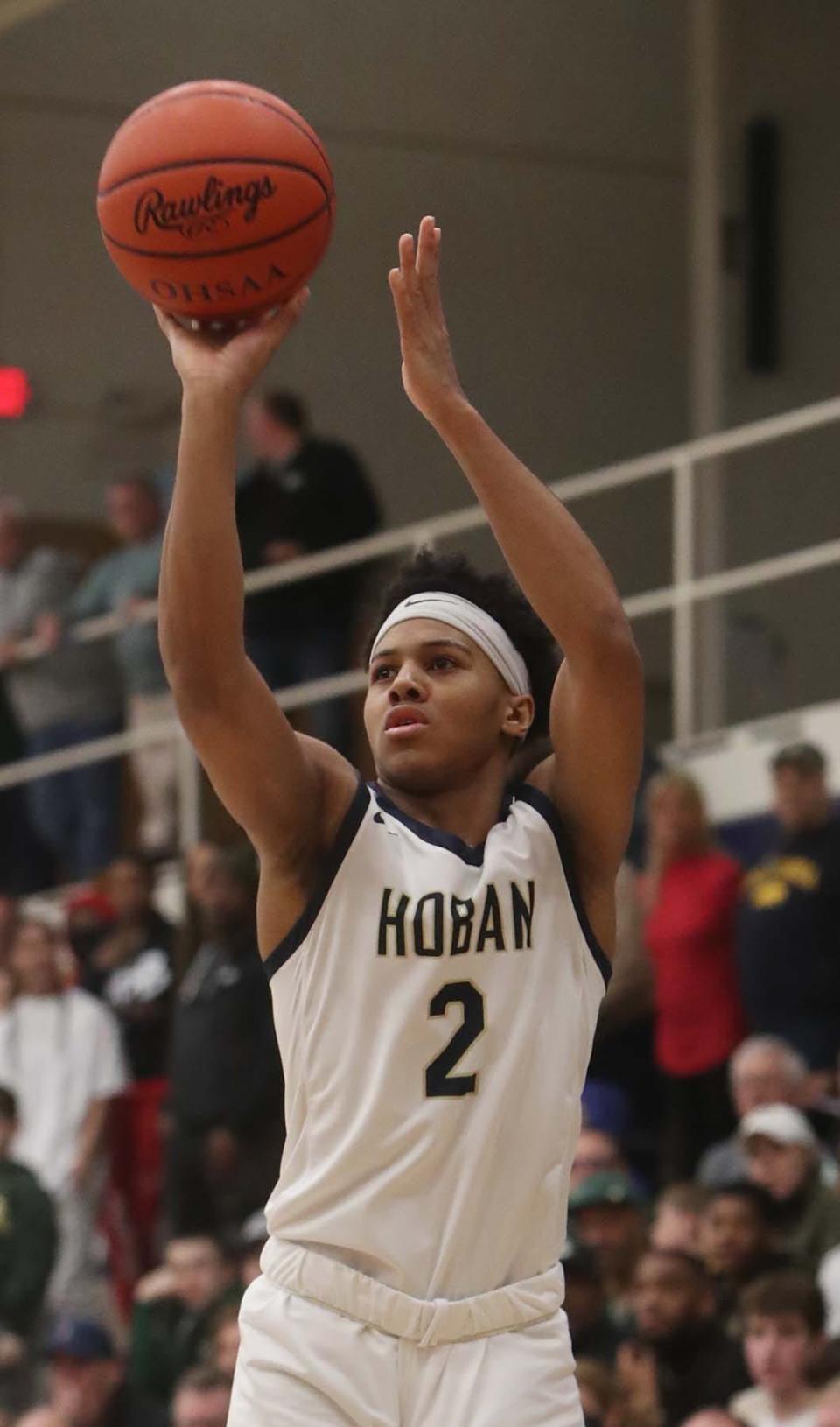 Archbishop Hoban's Will Scott shoots a 3-pointer against Lakewood St. Edward during their Division I regional final Saturday at Copley. St. Edward won 63-46. [Karen Schiely/Beacon Journal]