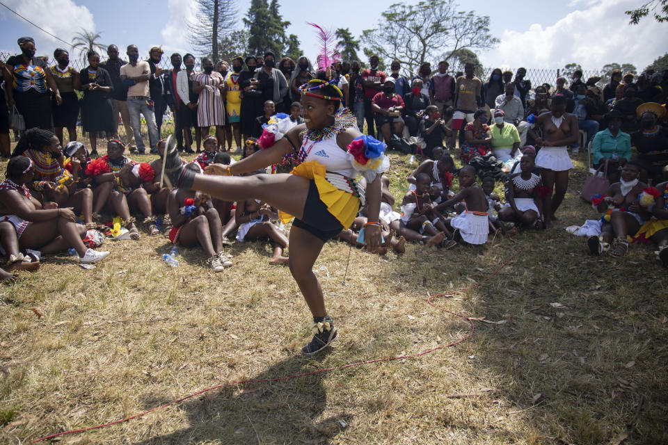 A young Zulu maiden dances at the memorial service for Zulu King Goodwill Zwelithini, in Nongoma, South Africa, Thursday, March 18, 2021. The monarch passed away early Friday after a reign that spanned more than 50 years. (AP Photo/PhilL Magakoe)