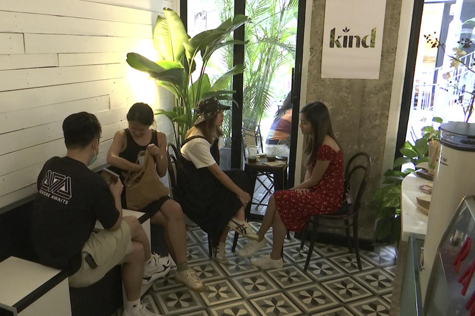 In this image made from a video, customers sit at tables in Hong Kong's first CBD cafe, Sept. 13, 2020. Hong Kong banned cannibidiol, also known as CBD, as a "dangerous drug" and imposed harsh penalties for possession on Wednesday, Feb. 1, 2023, forcing fledging businesses to shut down and revamp. (AP Photo/Alice Fung)