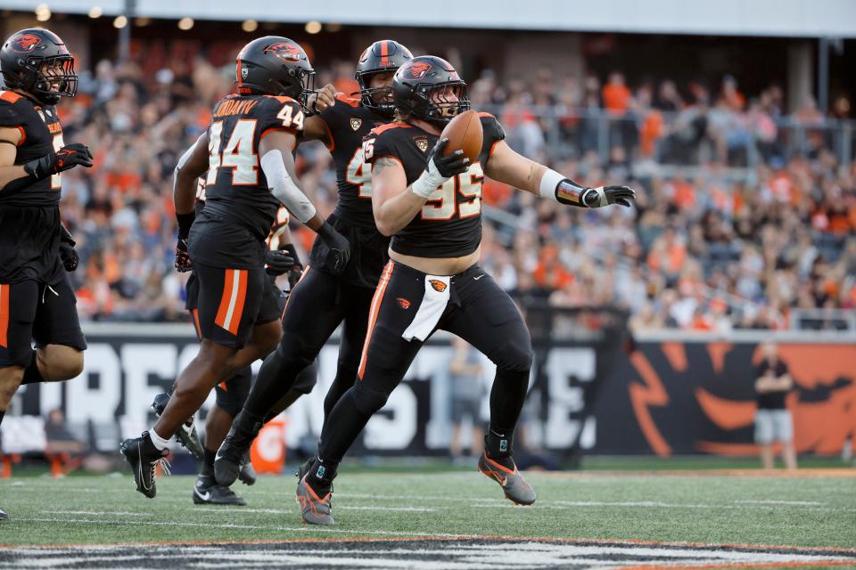 Oregon State defensive lineman Isaac Hodgins (99) celebrates after recovering a fumble against UC Davis.